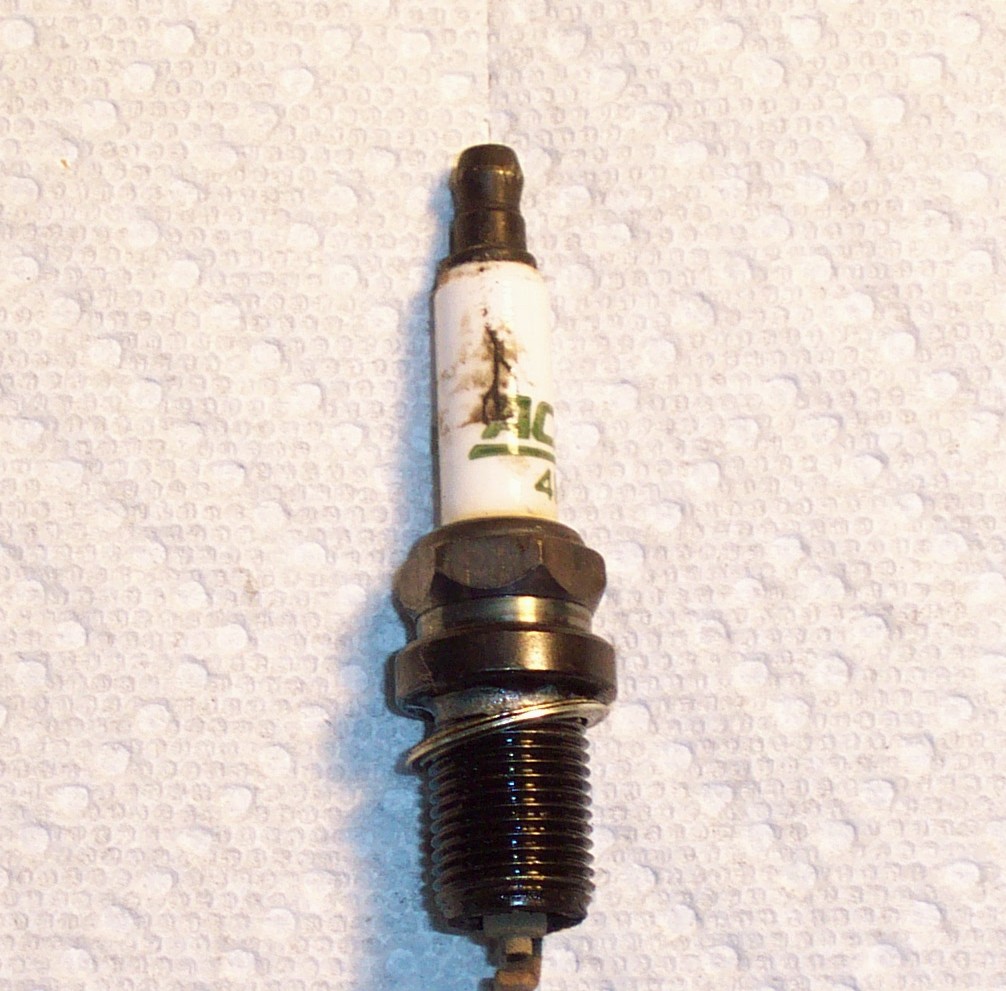 Spark plug carbon track